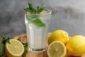 Lemons and glass of lemonade